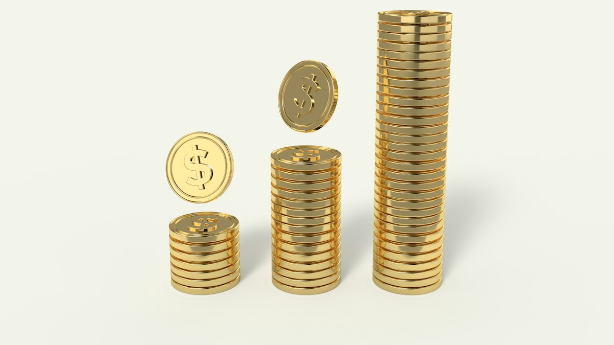 Three stacks of gold coins rising in height from left to right