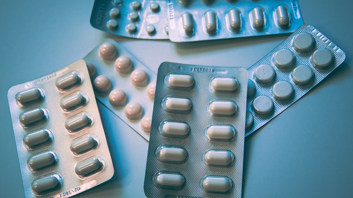 Blister packs of white and blue pills